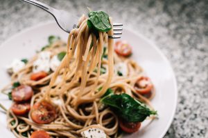 Beaumont: bowl of wheat noodles with tomato, basil, and chungs of cheese