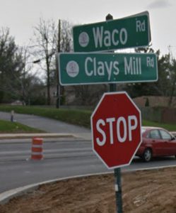 construction: stop sign that says clays mill/waco road