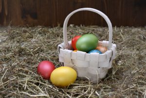 Egg Hunt: colored eggs in a white basket
