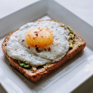 Brunch: fried egg with an avocado spread on toast