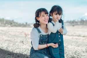 Mother's Day: mom and daughter in matching overalls