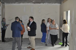 Bluegrass Care Navigators: group of people in a room under construction with writing on the wall