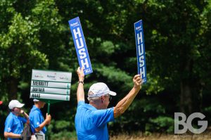 Barbasol: a man in a blue polo holding up two "hush" signs